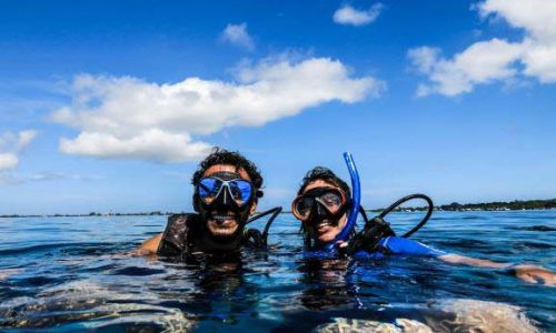 Two divers at the surface smiling after a great dive with Underwater Vision