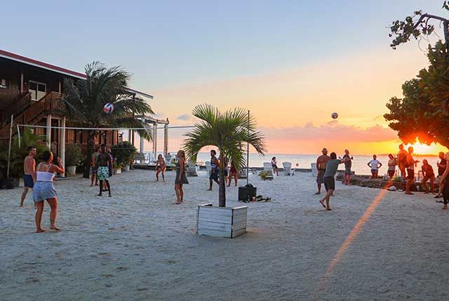 Fun at the beach playing volleyball after scuba diving in Utila